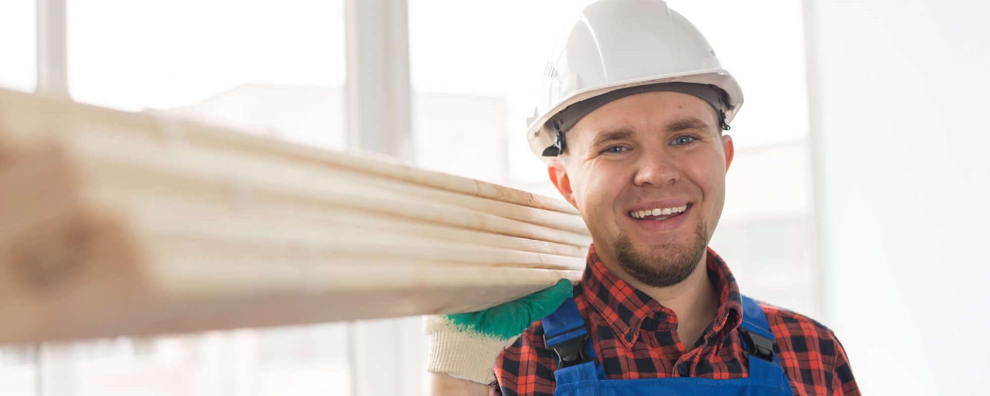 portrait-of-handsome-male-builder-laughing-infront-Q8N7DXV.jpg
